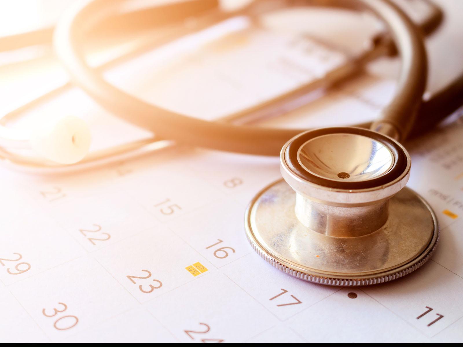 Stethoscope on top of calendar