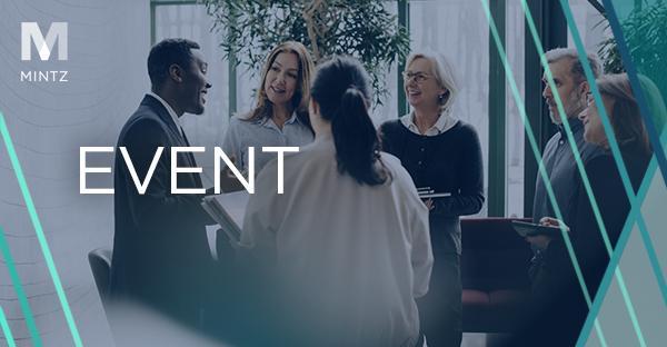 Image depicting professionals around a table in conversation