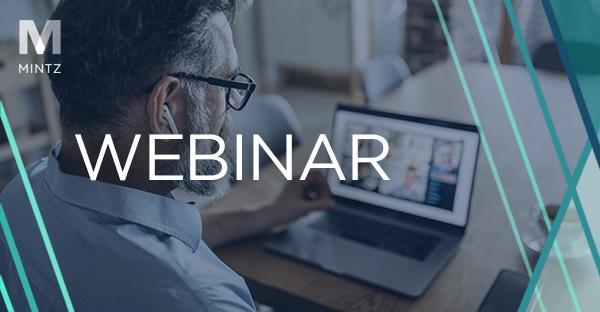 Image showing a man watching a webinar on a laptop